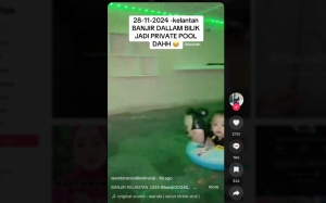 Kelantan woman turns basement into private pool party as heavy rains causes spring water to flood her home (VIDEO)