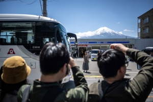 Tourists behaving badly force beleaguered town to block Insta-iconic Lawson Mount Fuji view (again)