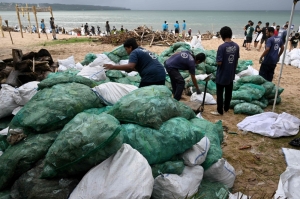 Hundreds of volunteers join cleanup effort as Bali faces ‘worst’ plastic pollution from monsoons